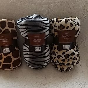 Three plush animal print throws